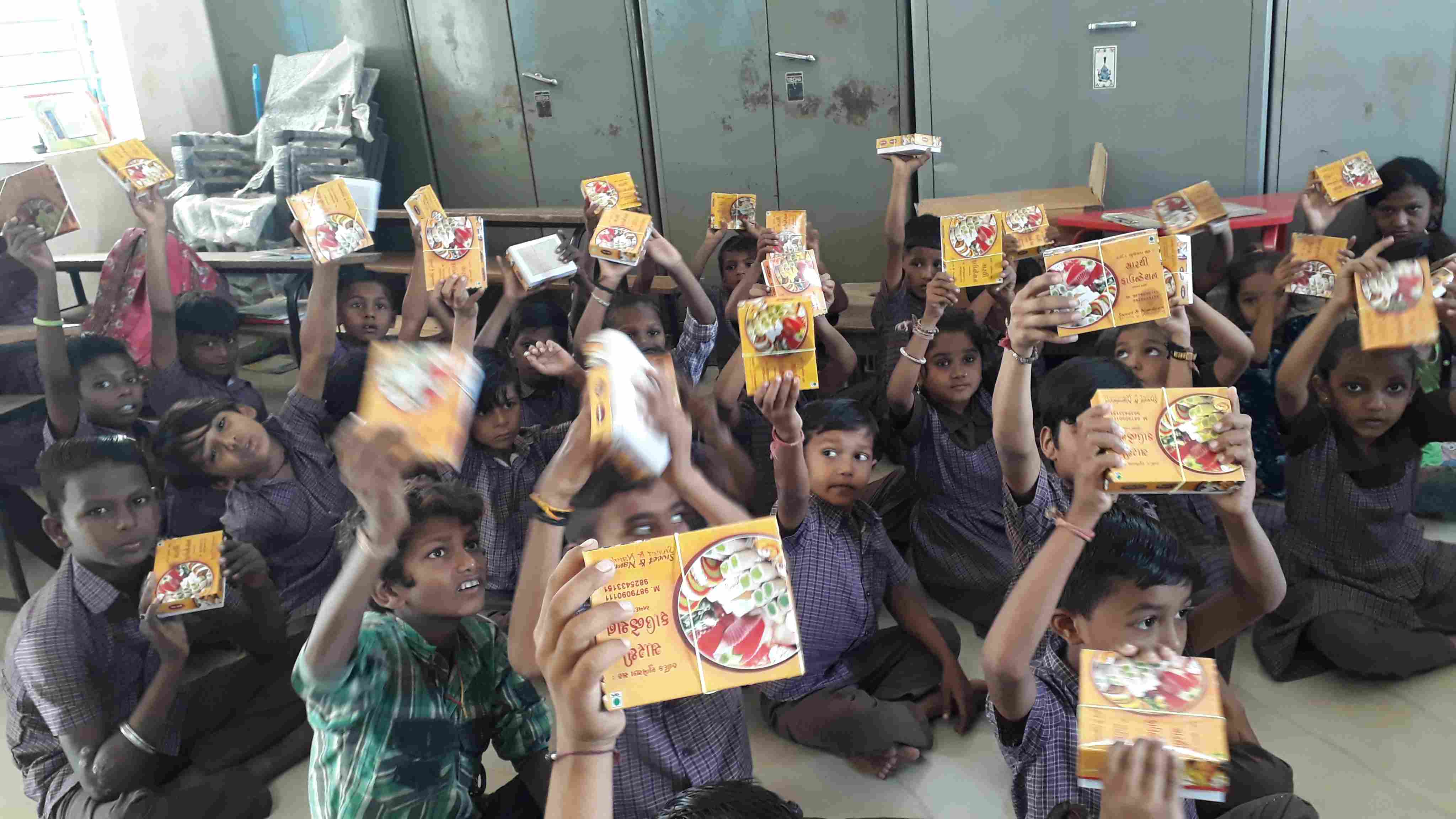 Children celebrating with sweets and gifts