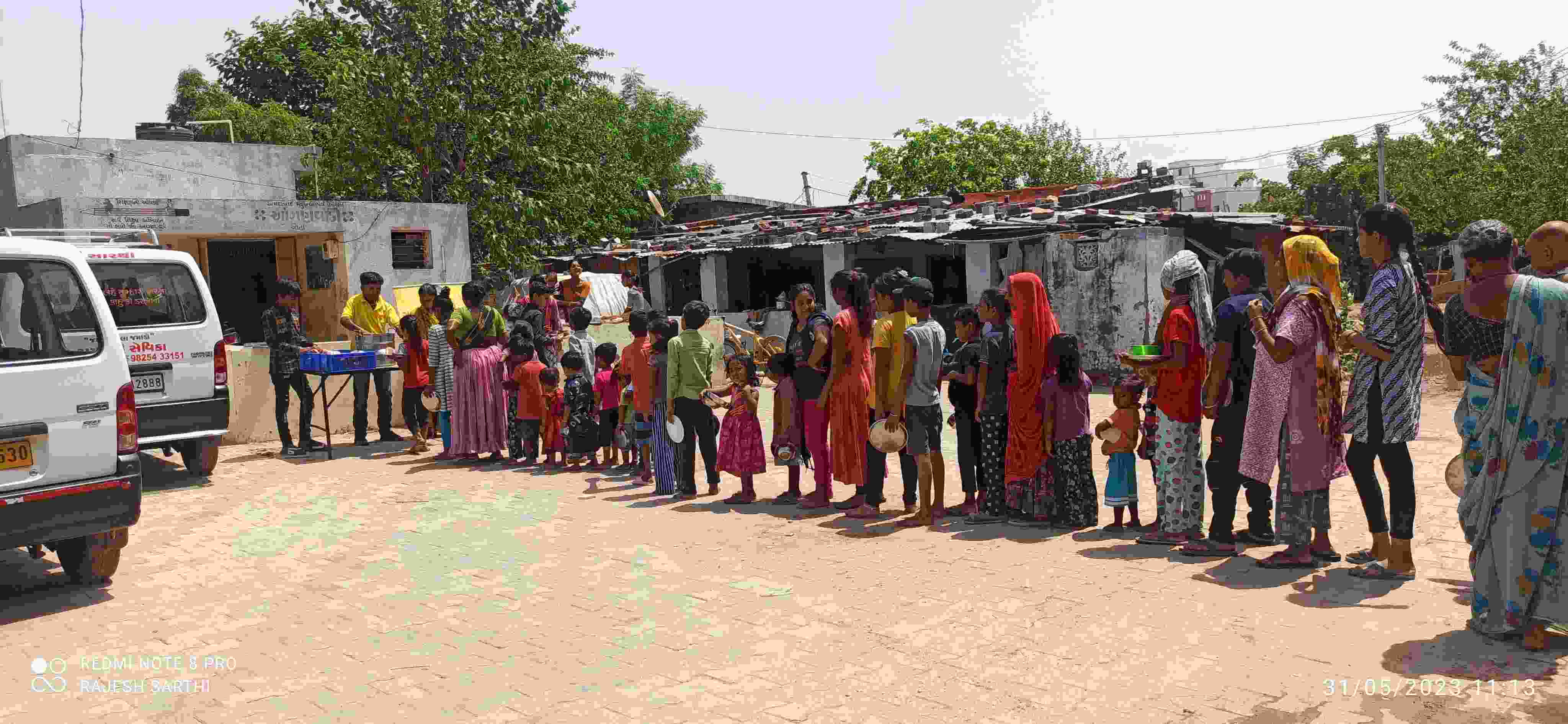 Long line of community members receiving food