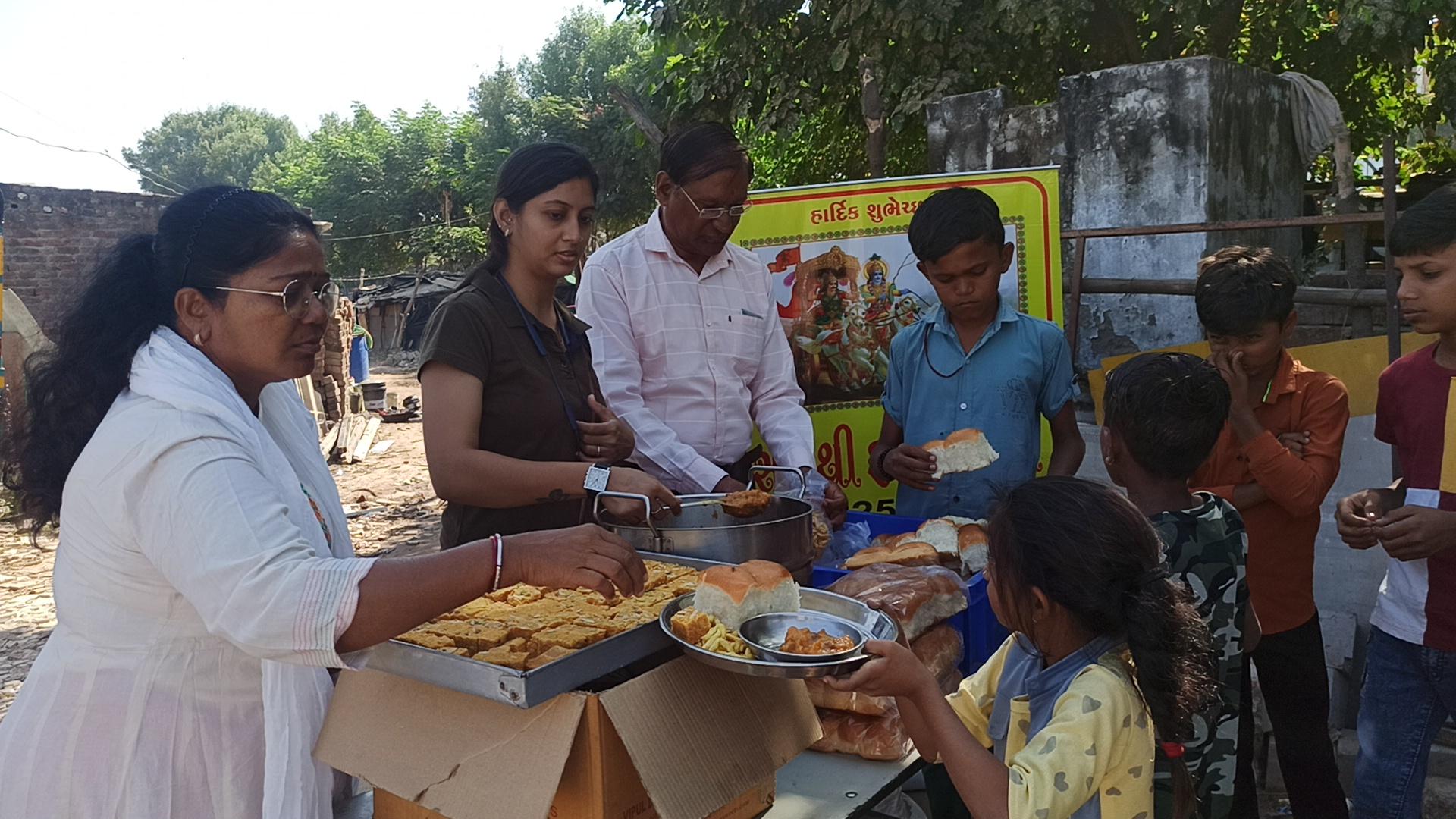 Volunteers serving food to community members