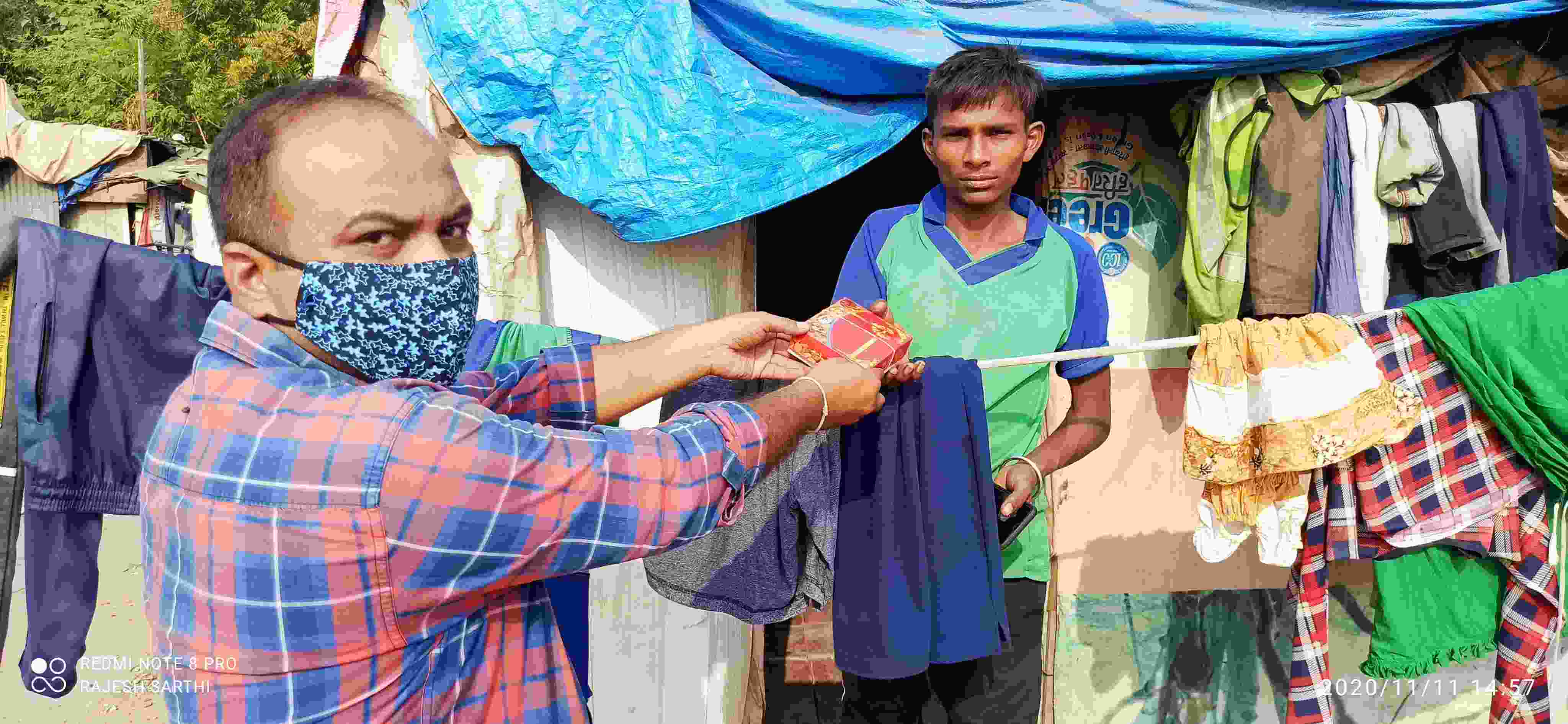 Masked volunteer distributing during COVID