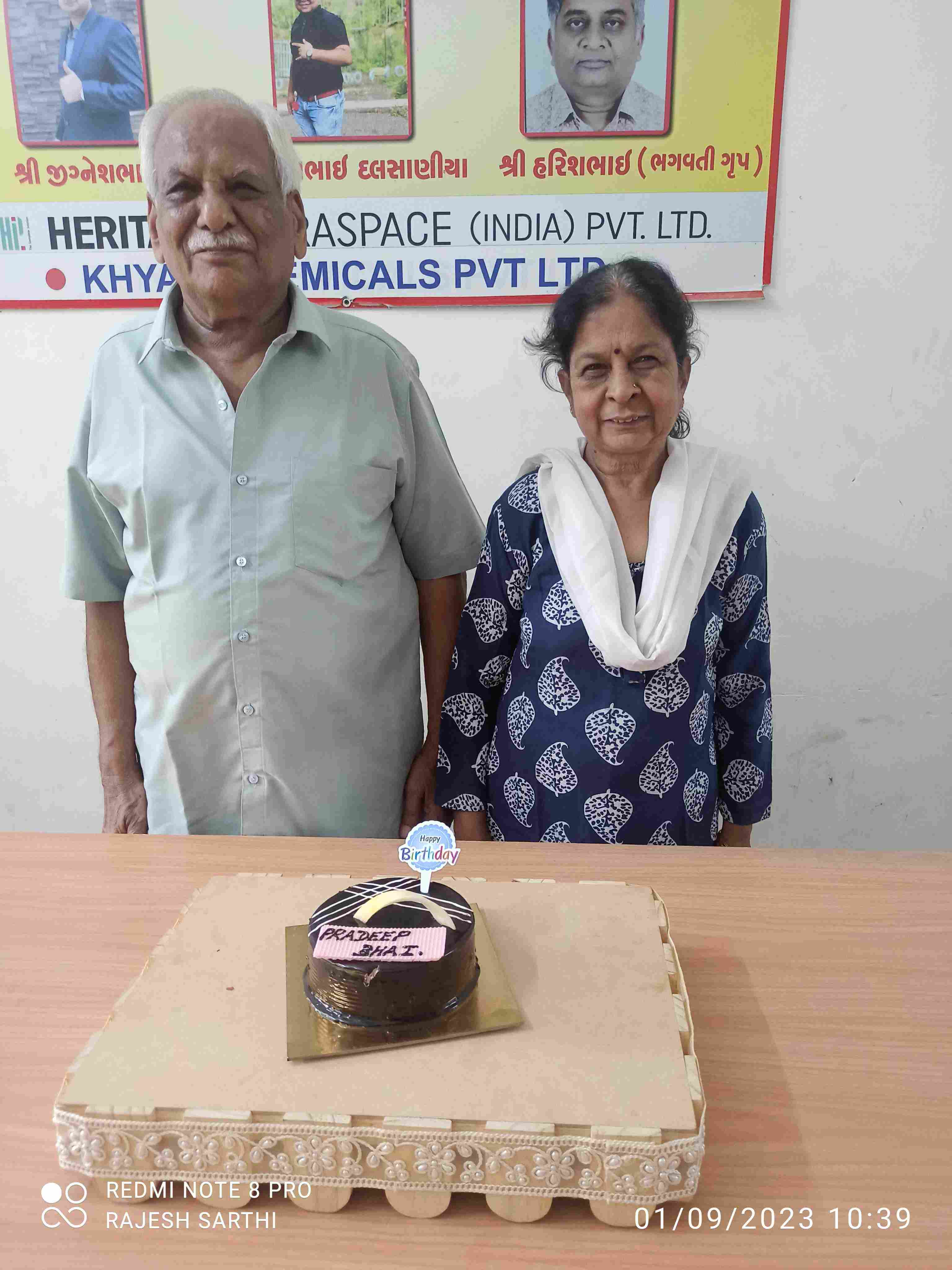 Elderly couple celebrating a birthday with cake