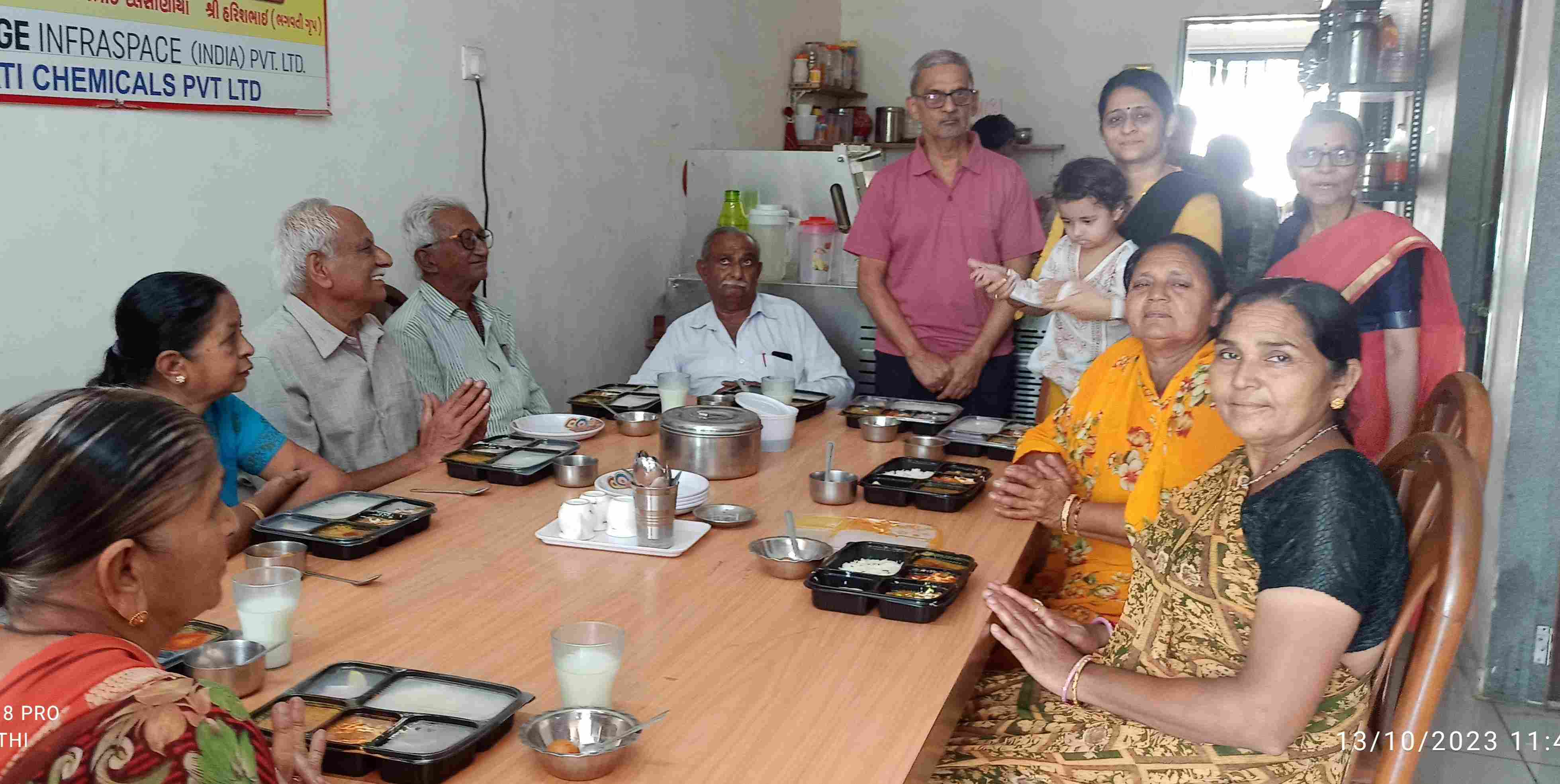 Group of residents having a meal together at a large table
