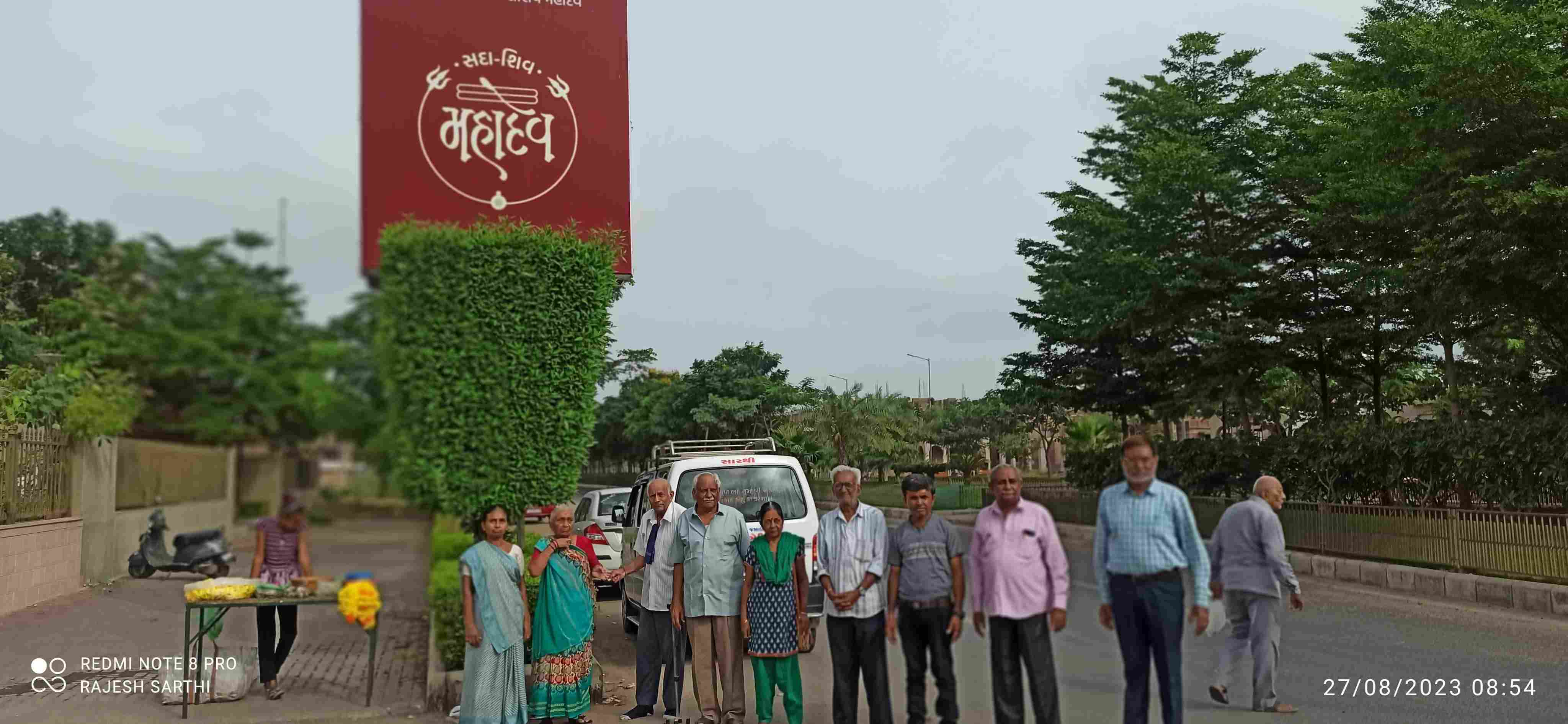 Residents of Sanatan Old Age Home standing at the entrance