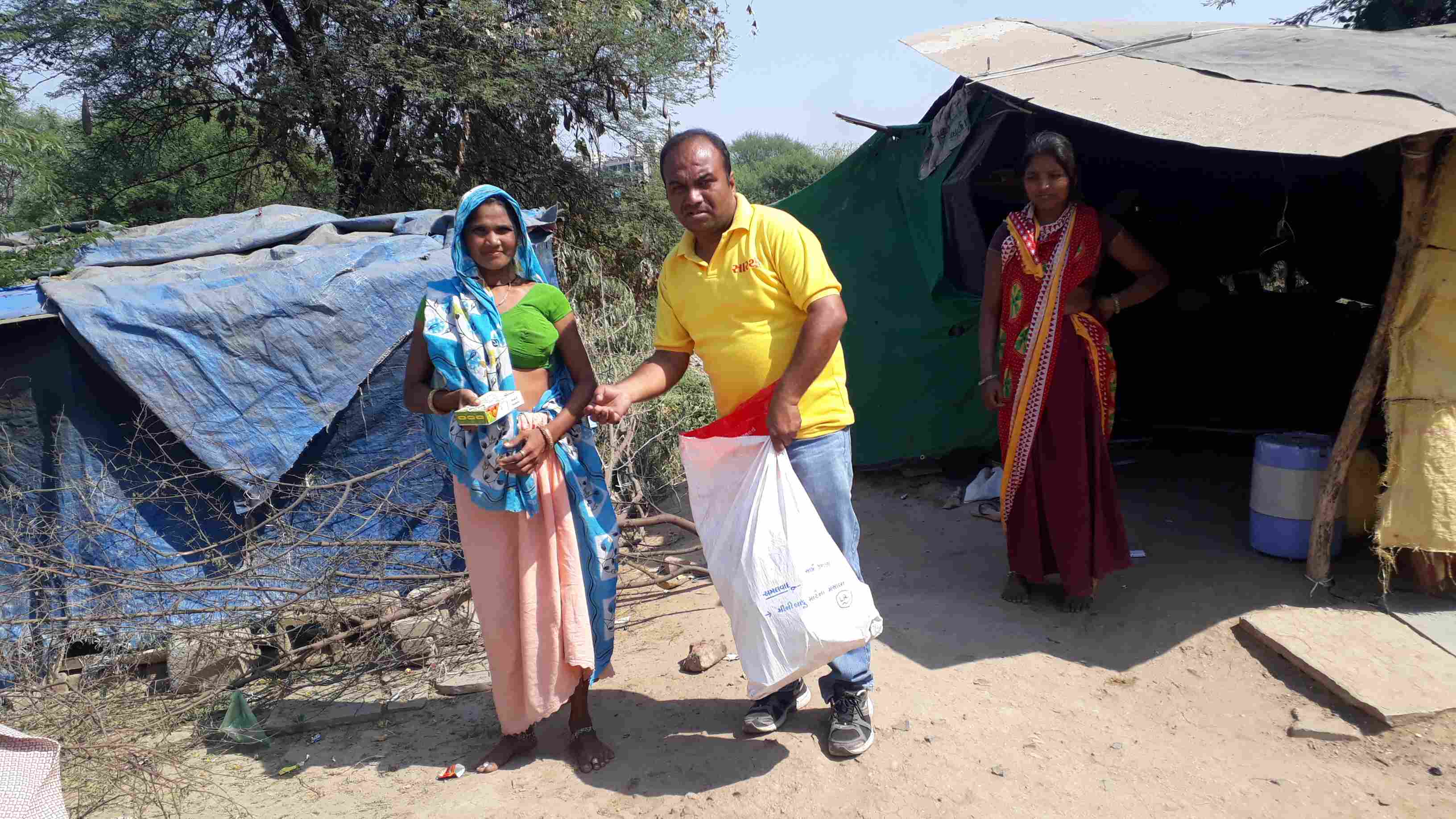 Volunteers distributing festival packages